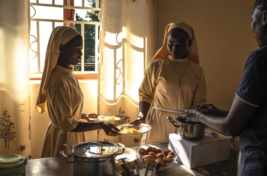 Sisters preparing and serving a meal