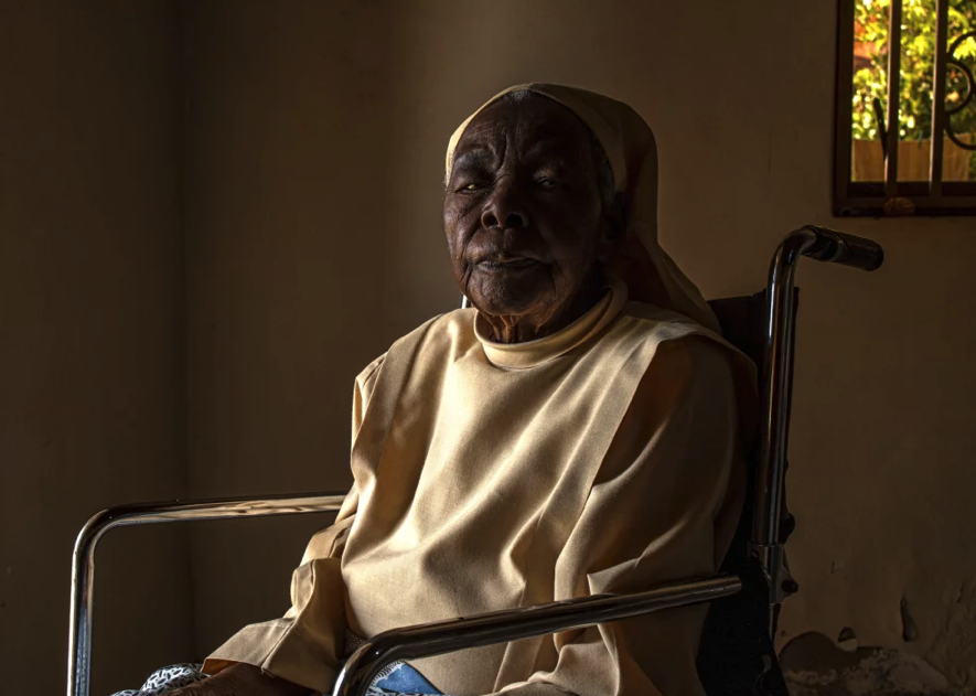 An elderly Sister seated in a wheelchair